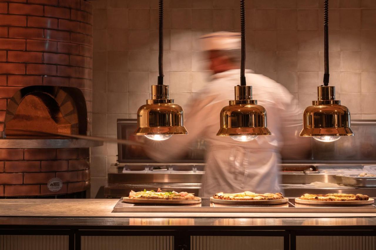 Helea Lifestyle Beach Resort Kallithea  Bagian luar foto Pizzas being prepared at a restaurant
